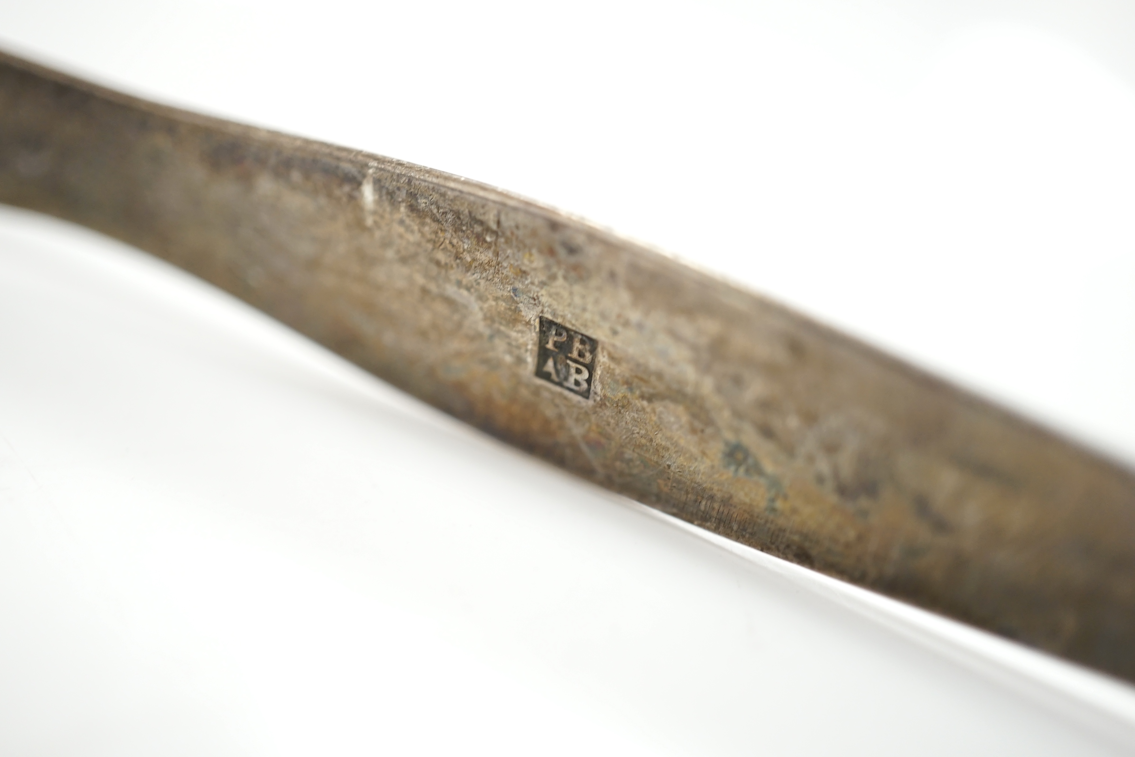 A pair of George V silver grape scissors, Sheffield, 1929, 18.6cm, together with a mother of pearl handled silver butter knife ad a pair of Georgian silver sugar tongs by Peter & Ann Bateman. Condition - poor to fair